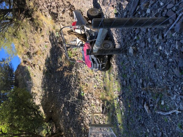 High Country Fencing - ATV on gravel